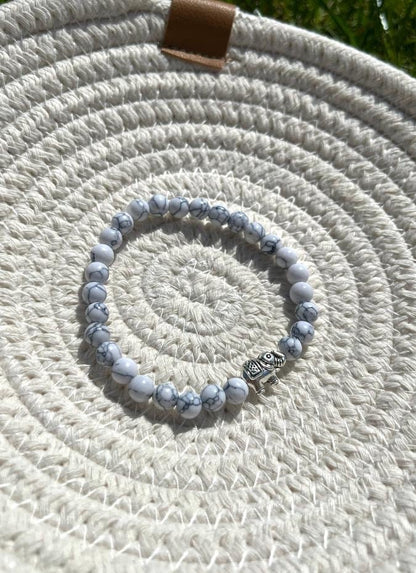 White & grey marble elephant charm bracelet with inspirational bravery/ strength/ courage quote card
