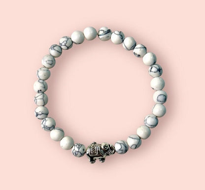 White & grey marble elephant charm bracelet with inspirational bravery/ strength/ courage quote card
